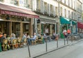 Many Parisians and tourists prefer the sidewalk tables at bistros and cafes
